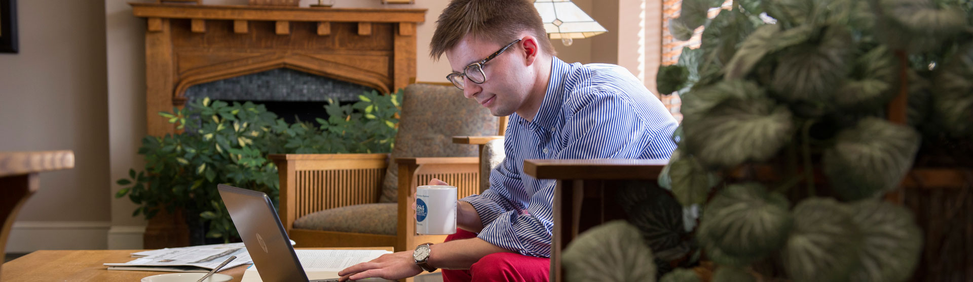 a man studying on a laptop