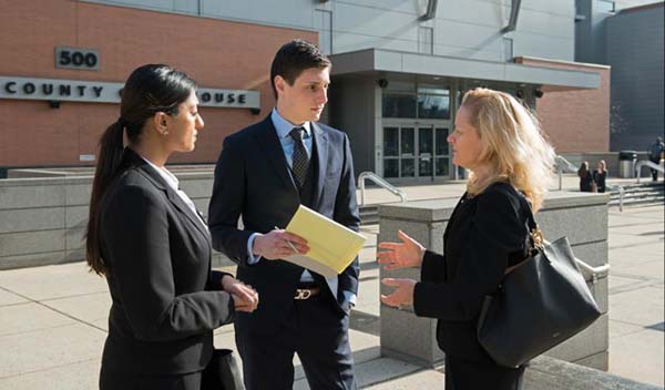 three people having a discussion