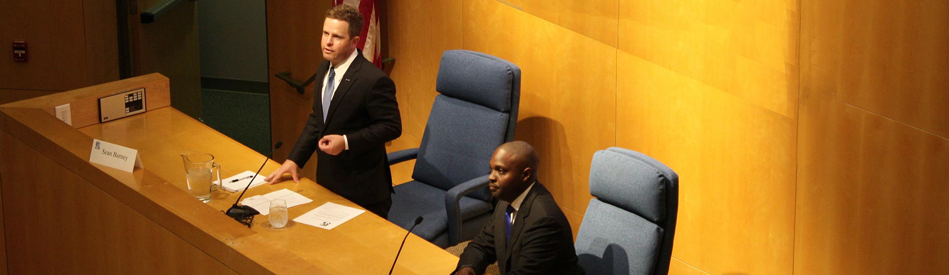 Two people engaged in debate