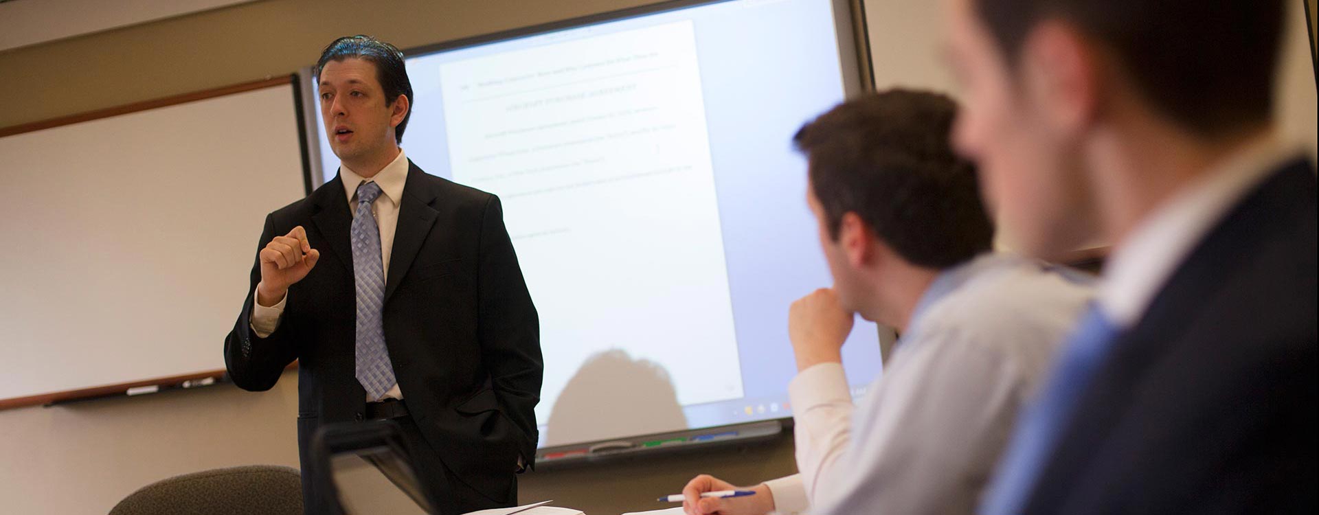 A man lecturing in front of a class